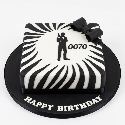 Square black and white 007 James Bond theme birthday cake with agent silhouette and bow.