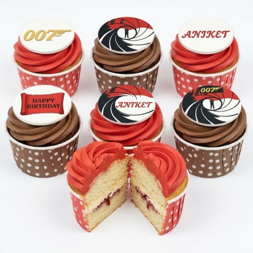 007 James Bond themed birthday cupcakes with red and chocolate frosting, featuring 007 logo and gun barrel toppers.