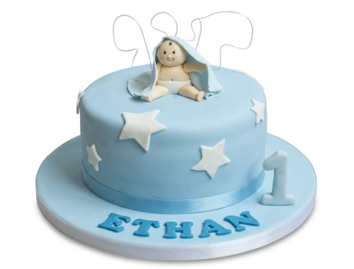 Light blue 1st birthday cake with a baby topper, white stars, and a custom age '1'.