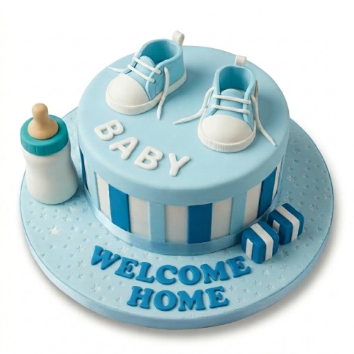 Round baby blue and white baby shower cake for boys with baby shoes, bottle, and personalised message.