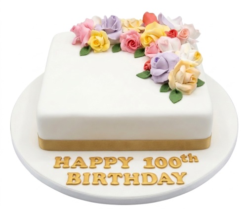 Elegant white square 100th Birthday Cake with pastel sugar roses and gold ribbon, with 'Happy 100th Birthday' in gold lettering.