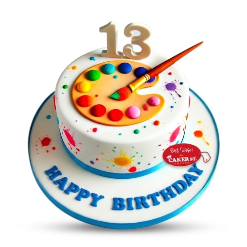 White round birthday cake with colourful paint splatters, an edible painter's palette, brush, and custom age topper.