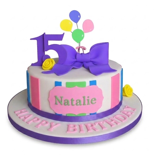 Colourful white birthday cake with purple bow, balloons, stripes, and custom age topper.