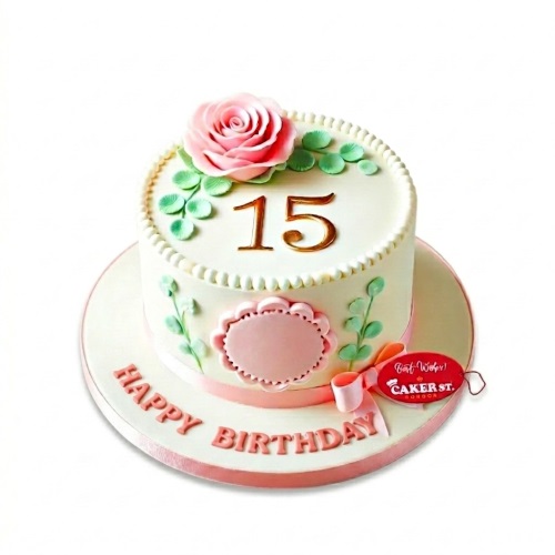 Elegant white birthday cake with pink sugar rose, green leaves, and gold custom age topper.