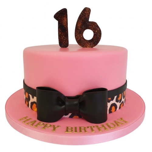 Pink round birthday cake with leopard print band, black bow, and custom age topper.