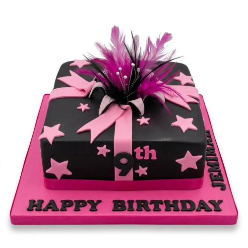 Square black and pink gift box birthday cake with feathers, ribbon, and stars.