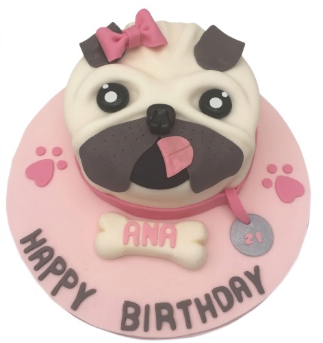 Pink round birthday cake with a 3D pug dog face, pink bow, collar, bone, and paw prints.