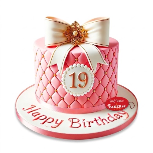 Elegant pink quilted birthday cake with a large white bow, gold embellishment, and a custom age plaque.
