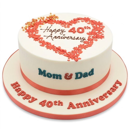 White 40th anniversary cake with red floral heart, gold sprinkles, and 'Happy 40th Anniversary' message.