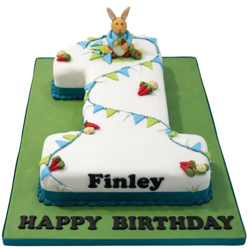 Number 1 shaped cake with rabbit topper, bunting, and personalised name 'Finley'.