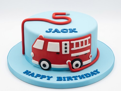Round light blue birthday cake with a red fire engine and hose, with blue personalised name and message.