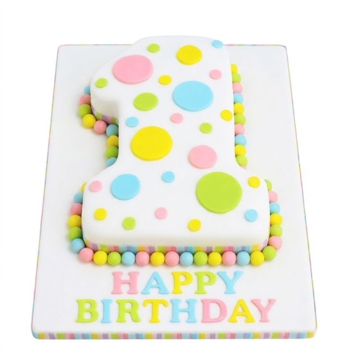 White number one shaped cake with pastel polka dots and edible beads for a 1st birthday.