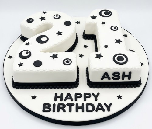White and black number birthday cake with stars, circles, and a custom age.