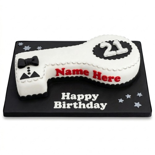White key-shaped 21st birthday cake with black tuxedo design and custom name.