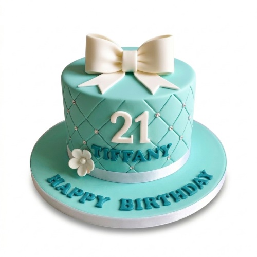 Tiffany blue quilted birthday cake with white bow, custom age, and flower.