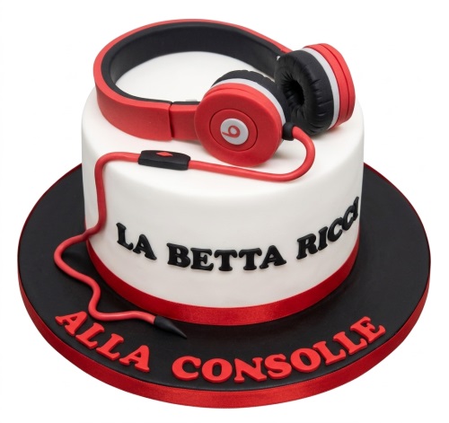 White round cake topped with red and black headphones, with red and black accents.