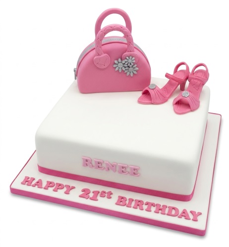 White square birthday cake with pink handbag, high heels, and custom message.
