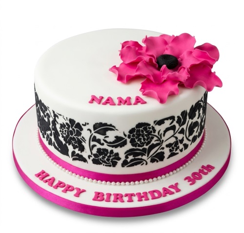 White round cake with black floral damask pattern, hot pink sugar flower, and pearl trim. Personalised birthday cake.
