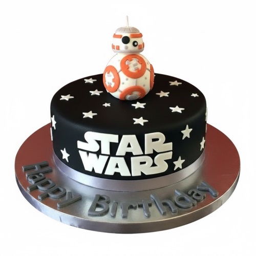 Round black Star Wars BB-8 birthday cake with white stars and 'Happy Birthday' message