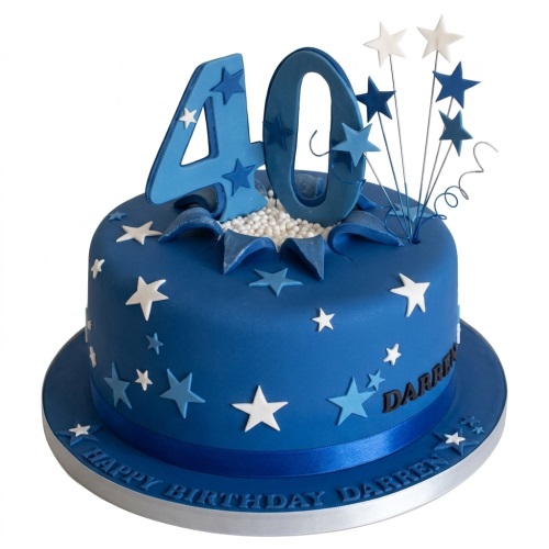 Blue birthday cake with white and blue stars, a custom age number topper, and starburst decorations.