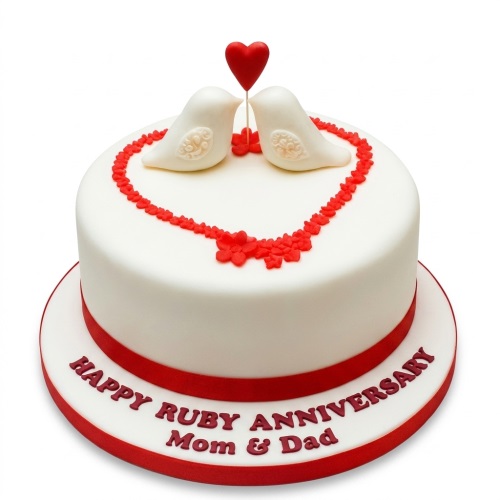 White round cake with red ribbon, two white lovebirds, and a red heart topper, with a red floral heart design.
