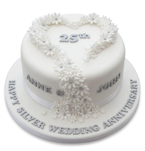 White round cake with silver '25th' and floral heart design, 'Happy Silver Wedding Anniversary' message