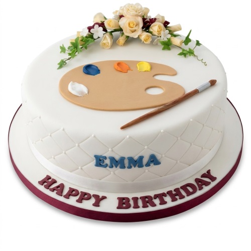 Two-tier white painting theme birthday cake with edible artist's palette, paintbrush, and sugar flowers.