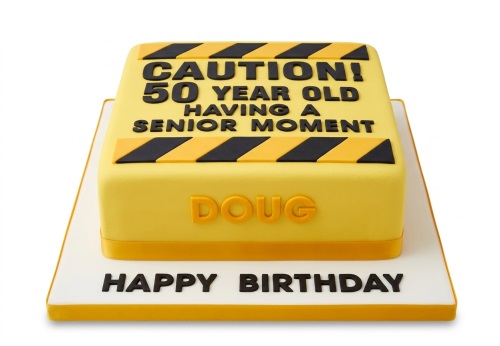 Yellow square birthday cake with black and yellow caution stripes and custom age message.