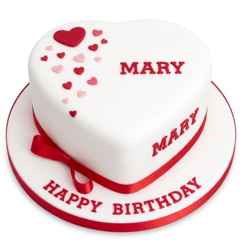 White heart-shaped birthday cake with red and pink hearts, red ribbon, and space for a custom name and message.