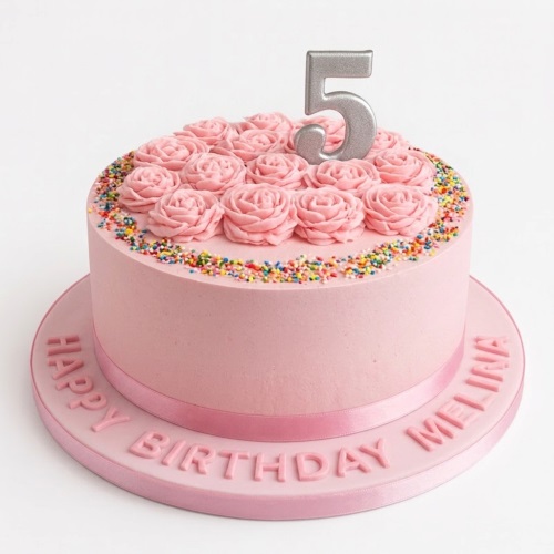 Pink round birthday cake with piped roses, colourful sprinkles, and a silver custom age topper.