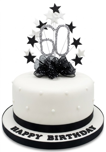 White round birthday cake with a sparkling custom age topper, black and white stars, a black bow, and "Happy Birthday" message on the base.