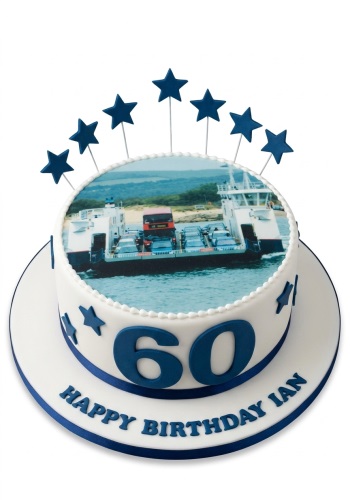 Round white birthday cake with a ferry photo, blue stars, and custom age numbers.