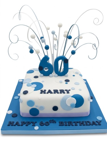 Square white birthday cake with blue and white dots, a dynamic burst topper, and a custom age number.