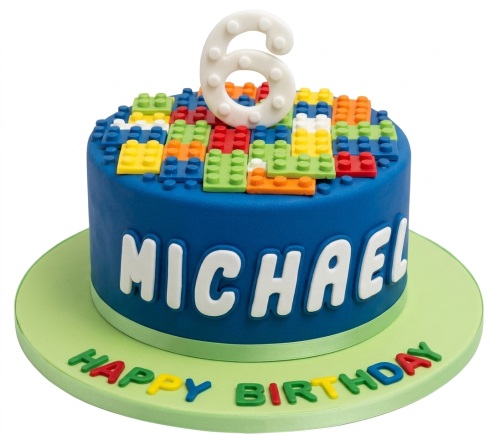 Blue round birthday cake with colourful building blocks, a custom age topper, and a personalised name.
