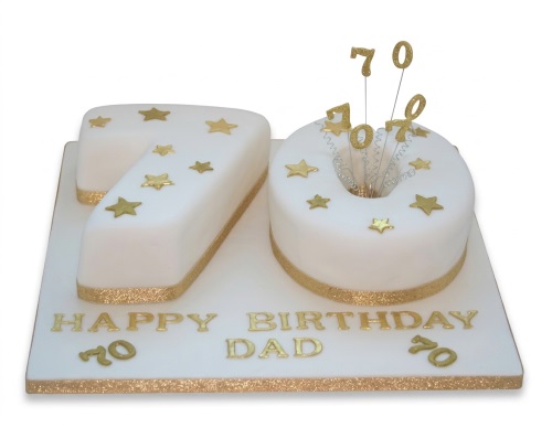 White and gold 70th birthday number cake with stars and 'Happy Birthday Dad' message.