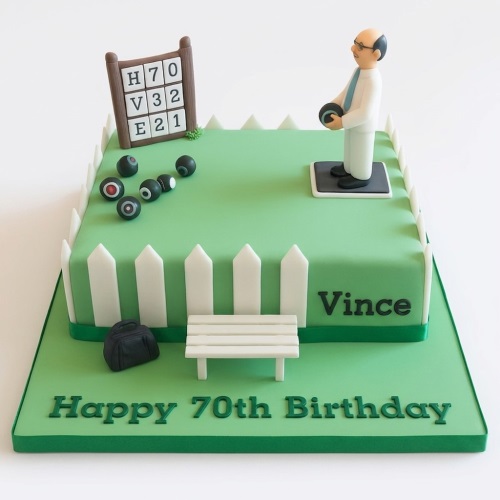 Lawn bowls themed birthday cake with a man playing bowls, green lawn, white fence, and 'Happy 70th Birthday' message.