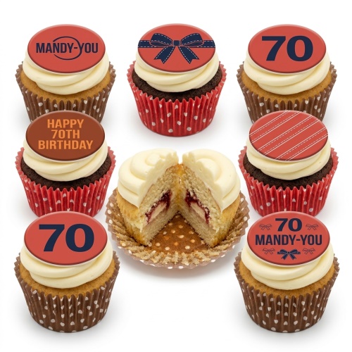 A selection of birthday cupcakes with red and white frosting, topped with red edible discs featuring a dark blue bow, stripes, and the number 70.