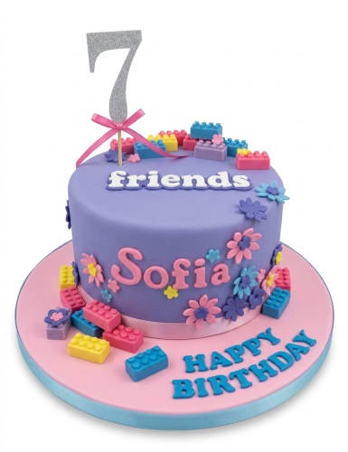 Purple birthday cake with colourful building blocks, fondant flowers, and a silver custom age topper.