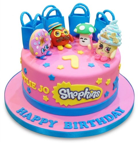 Pink Shopkins birthday cake with characters, shopping bags, stars, and custom age topper.