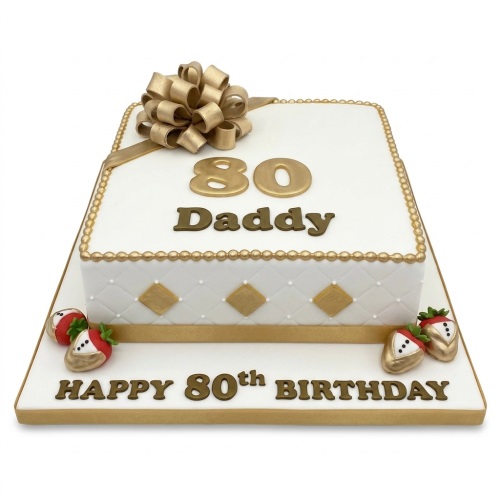 White and gold square 80th birthday cake with a bow and tuxedo strawberries on the board.