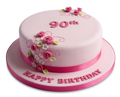 Elegant pink birthday cake with dark pink fondant roses, white flowers, and green leaves, with a custom age topper and 'Happy Birthday' message.