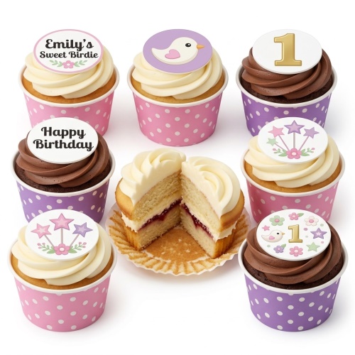 Kids birthday cupcakes with birdie, star, and floral toppers in pink and purple wrappers.