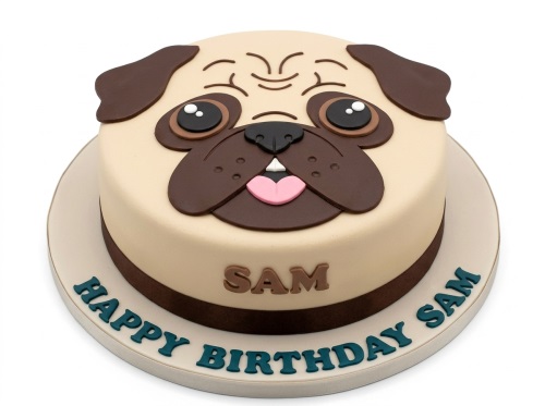 Round beige and brown pug dog face birthday cake with a pink tongue and "Happy Birthday" message on the board.