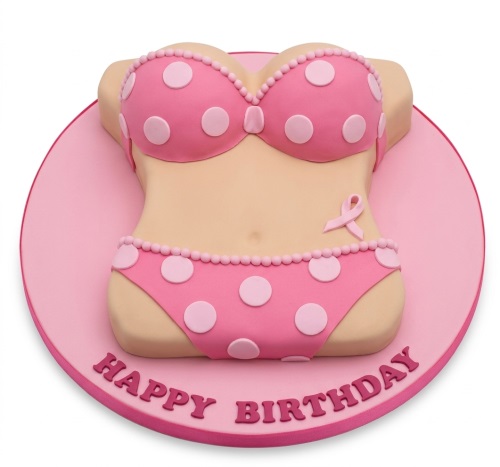 Pink polka dot bikini shaped birthday cake with a subtle pink ribbon detail on a round board.