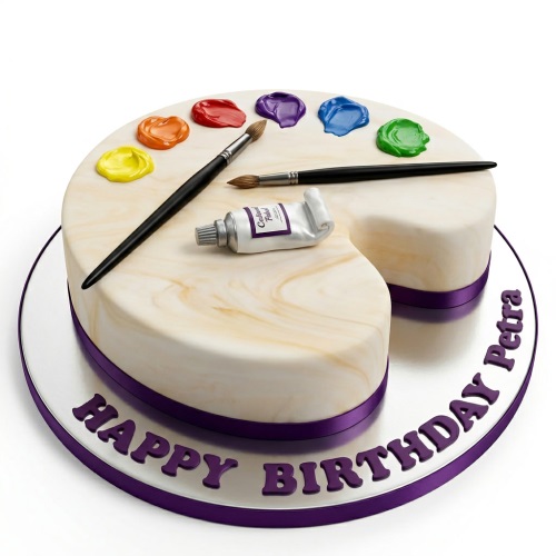 Artist's palette birthday cake with colourful edible paint dabs and paintbrushes.