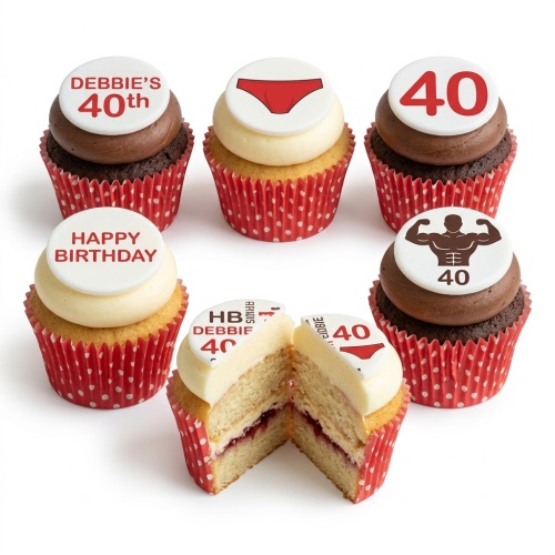 Humorous birthday cupcakes with red polka dot wrappers, featuring underwear, bodybuilder, and custom age toppers.