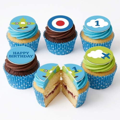 Assorted aeroplane themed birthday cupcakes with blue, green, and brown frosting, featuring plane and cloud toppers.