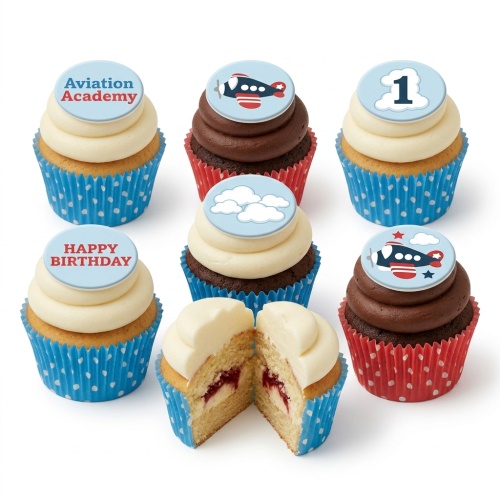 Cupcakes with blue and red aeroplane toppers, white clouds, '1' and 'Happy Birthday' messages, in blue and red polka dot wrappers.
