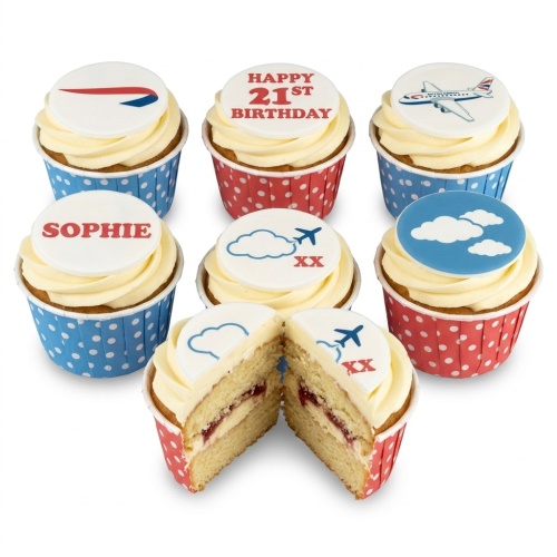 Vanilla cupcakes with aeroplane, cloud, and British Airways logo toppers. Red and blue polka dot wrappers.