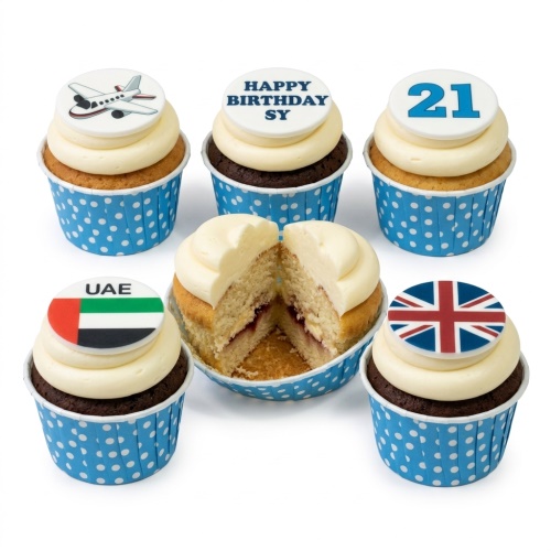 Birthday cupcakes with aeroplane, Union Jack, UAE flag, and custom age and message toppers.